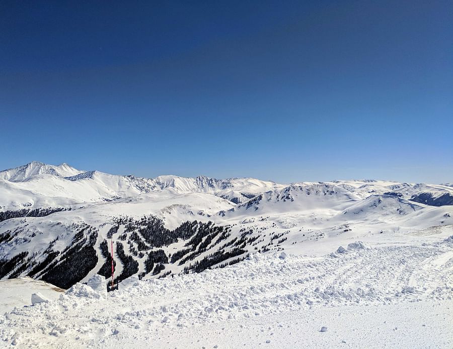 Snowy mountain peak with ski tracks in Colorado